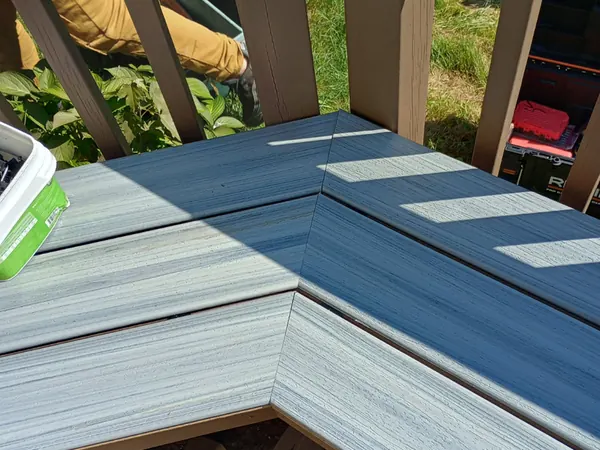Corner bench built into a composite deck