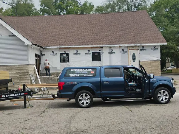 Home addition wrapped in house wrap with our truck parked out front